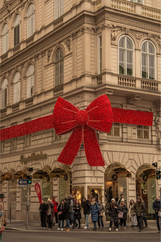 The Big Red Festive Bow at the Façade of Popp & Kretschmer in Vienna