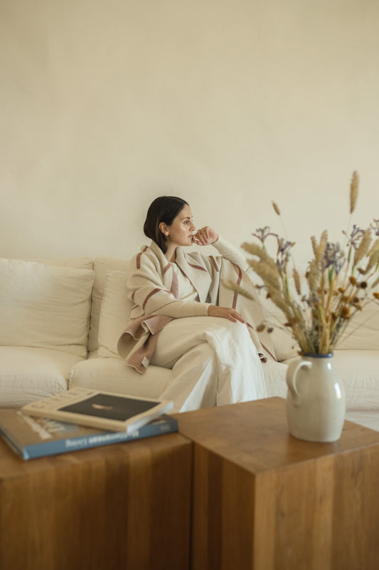 Sonia sitting in Casa no Tempo, in Alentejo