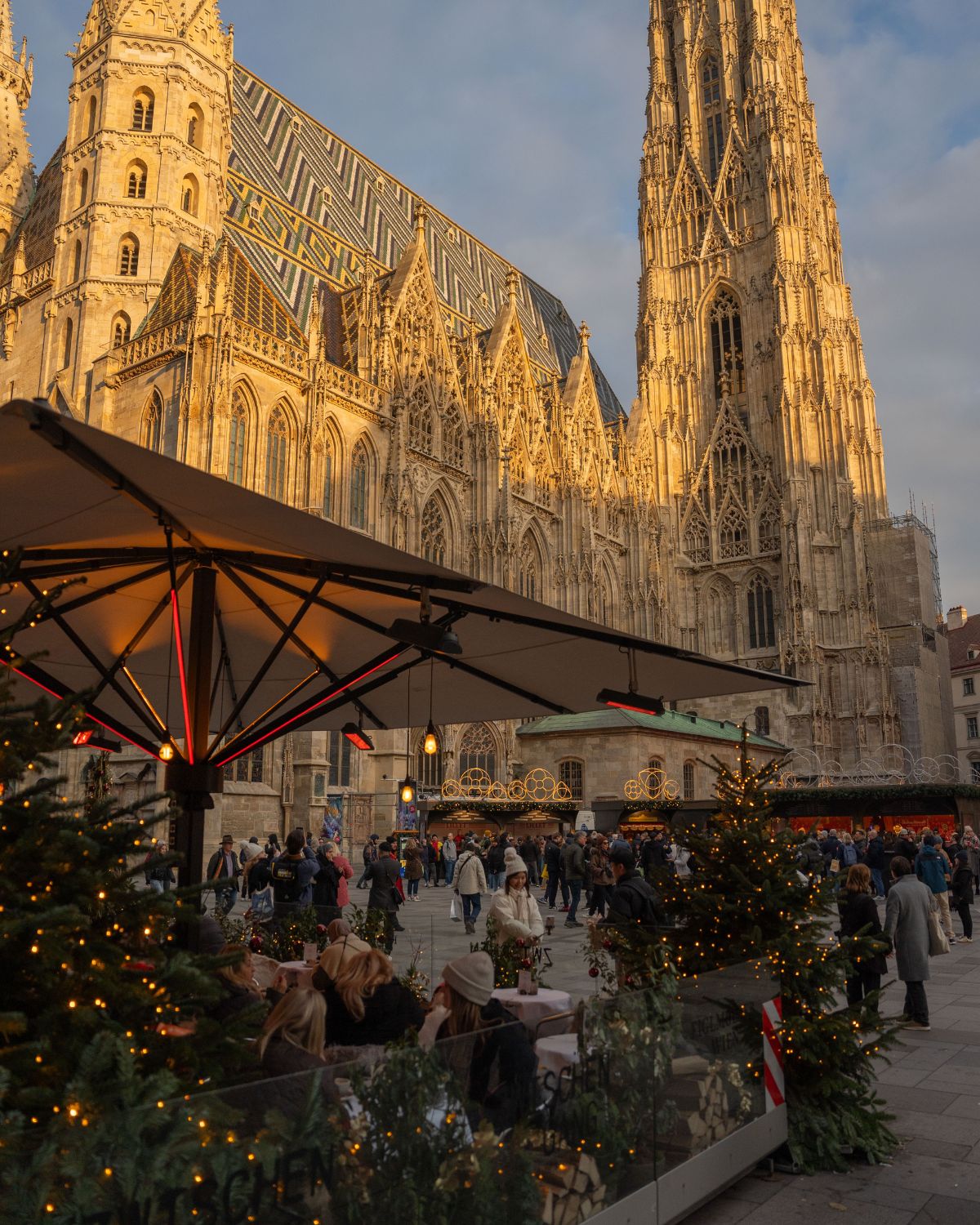 A Christmas market in front of a cathedral.