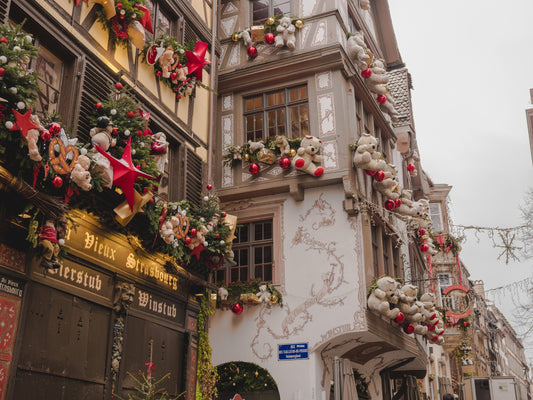 The iconic façade of restaurant Le Tire Bouchon, in Strasbourg, decorated with festive teddy bears