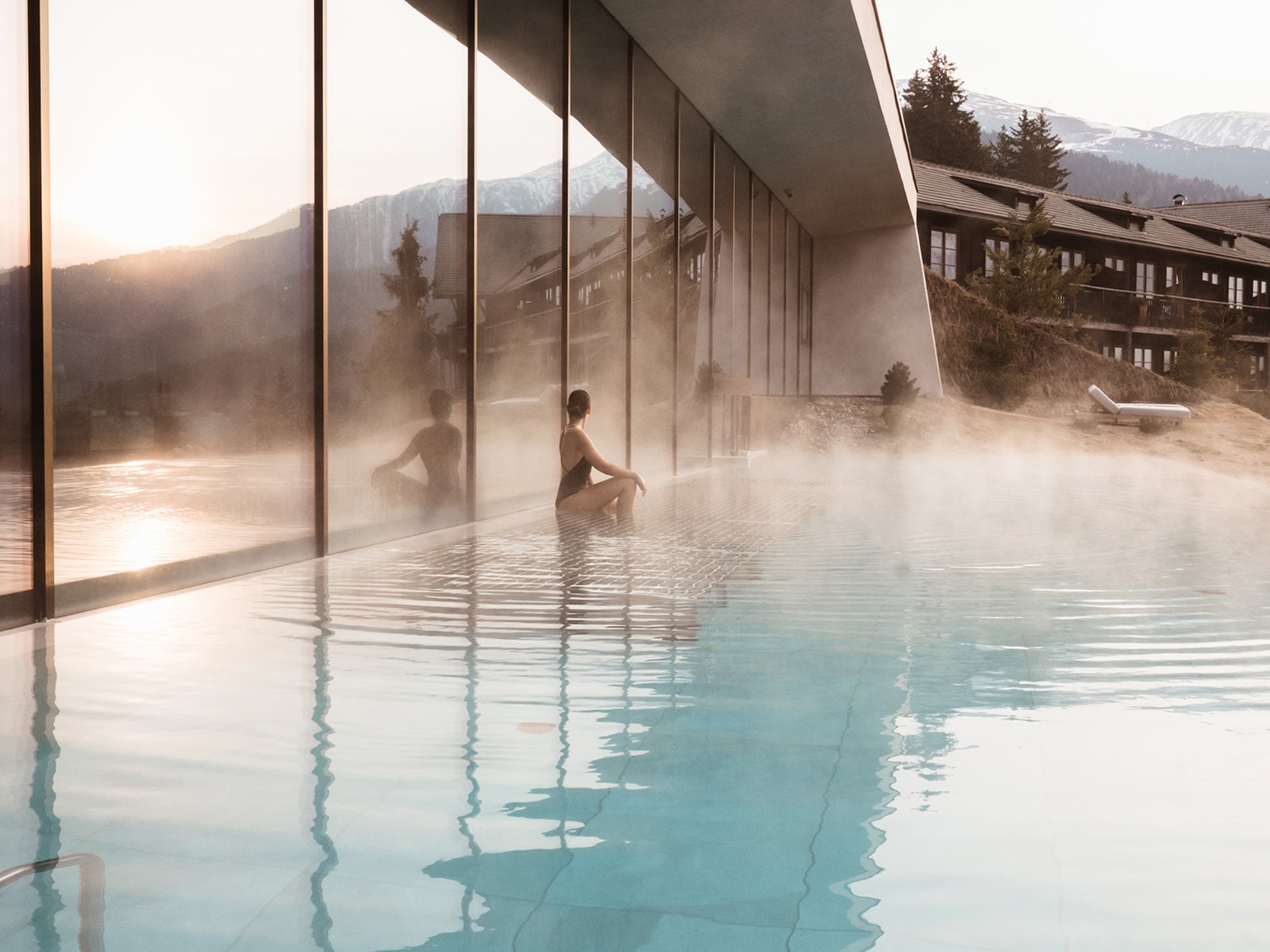 Outdoors pool of Hotel Forestis Dolomites, on a cold early spring morning