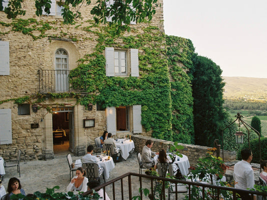Terrace of the restaurant at Hotel Crillon-Le-Brave, with sunset views over the hills of Provence