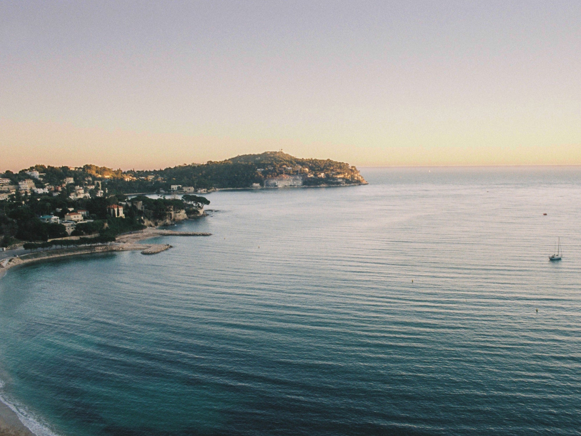 Bay of Villefranche-sur-Mer, with Cap Ferrat in the distance, at sunset, in the South of France