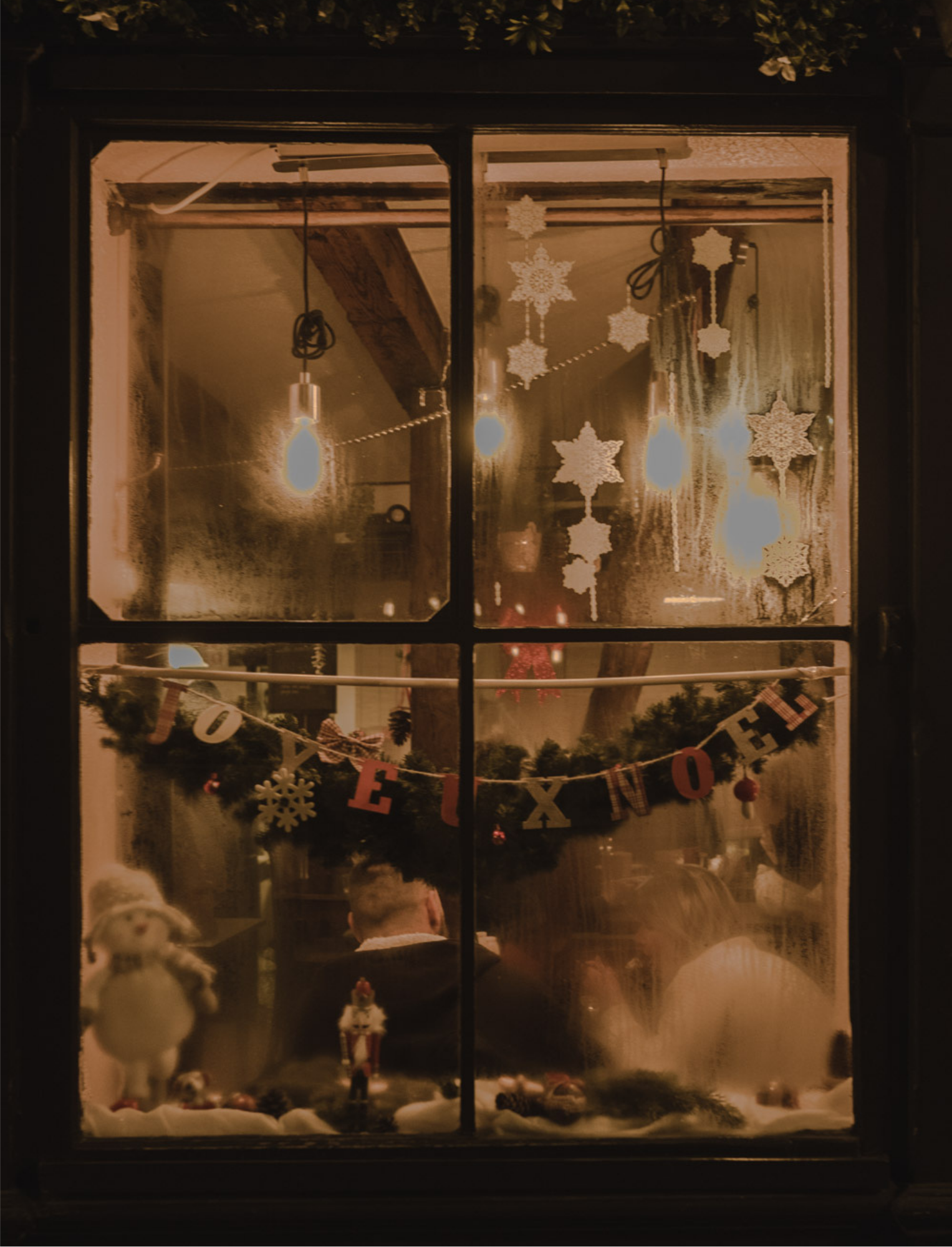A Guide to Alsace, Christmas Edition - page with picture of decorated restaurant window, by Simply Slow Traveler