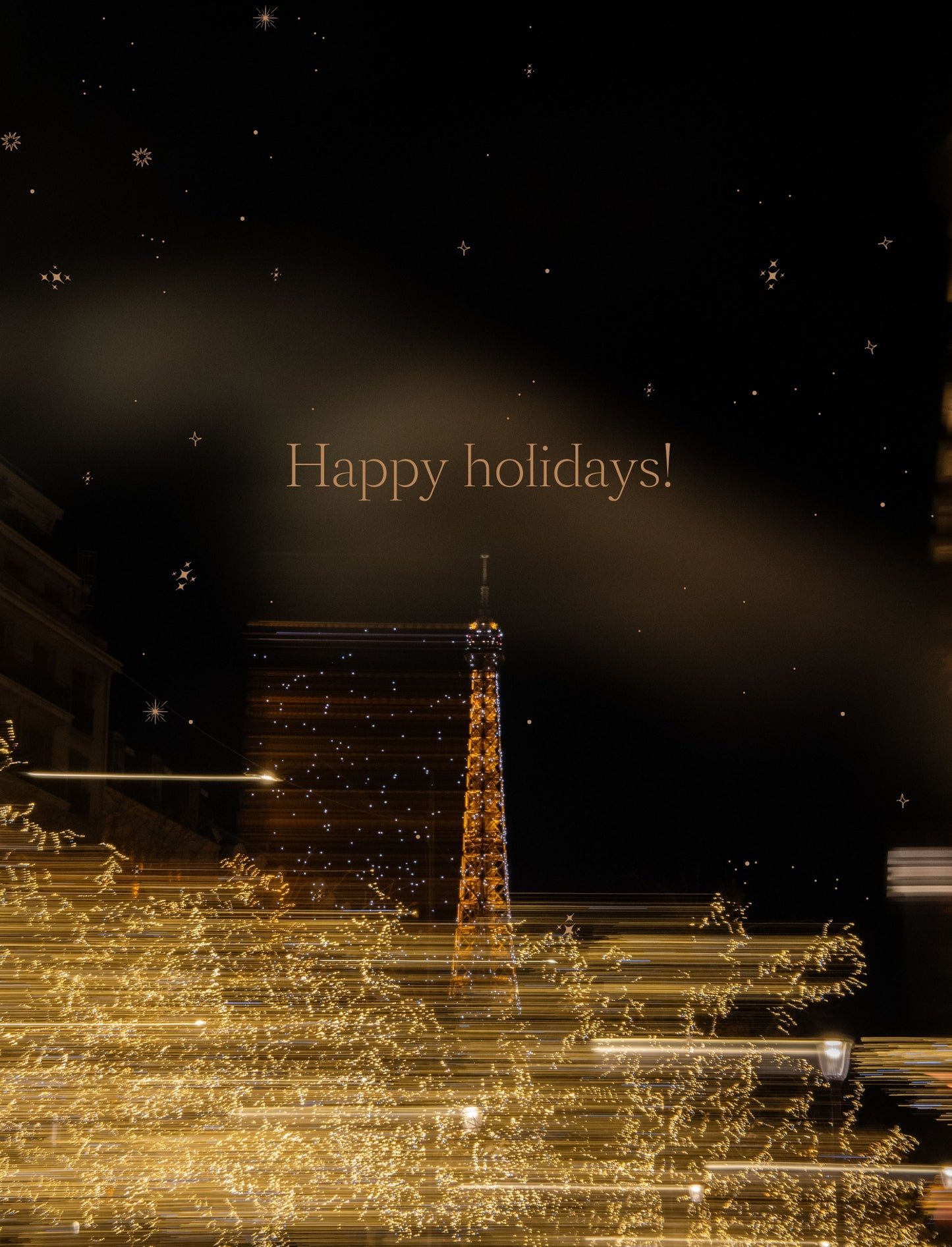 Page with the Eiffel Tower at night seen from a fully illuminated Avenue Montaigne, from the Paris - Christmas Edition Travel Guide