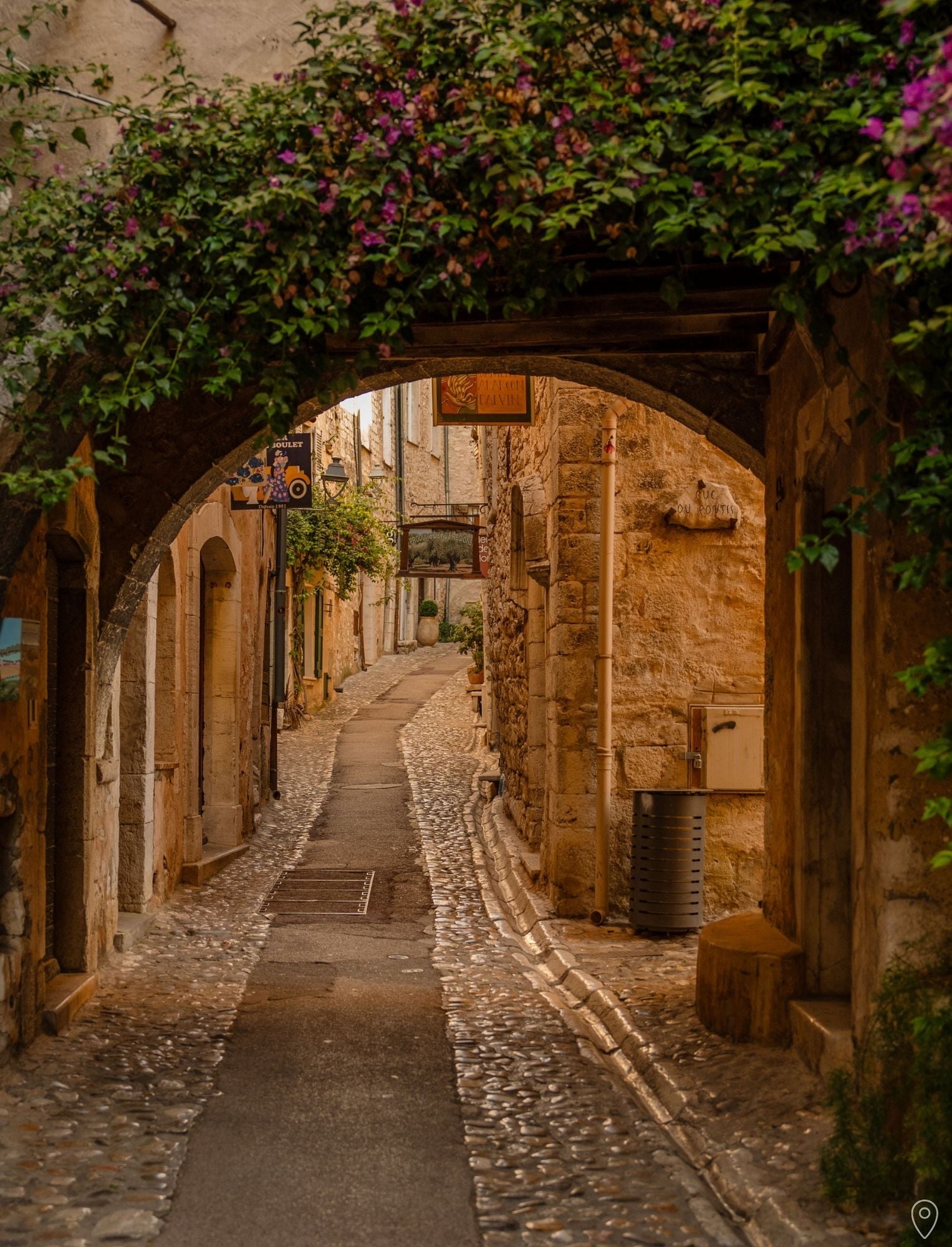 A Guide to the French Riviera in 14 Days - page with a photo of an archway in Saint-Paul-de-Vence, by Simply Slow Traveler