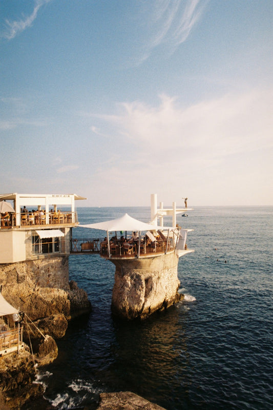 Restaurant Le Plongeoir, in Nice, set on top of a limestone stack right by the coastline, in a late Summer afternoon