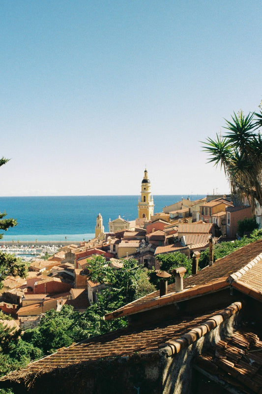 The rooftops of Menton, in the French Riviera by the border with Italy, with the azure Mediterranean afar