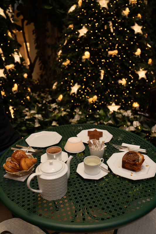 A table at Café Dior, in Avenue Montaigne, with the famous Dior Étoile and a few pastries, tea and hot chocolate