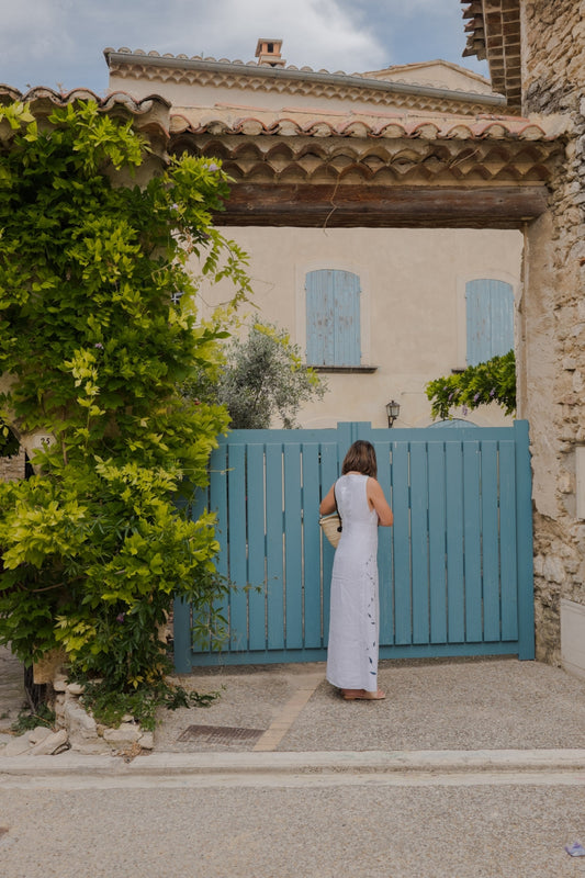 A wooden blue gate in the medieval village of Venasque, in Provence