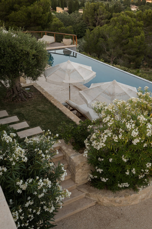 The swimming pool area of Le Mas Estello, a luxury private vacation rental villa in the hills of Les Alpilles, in Provence