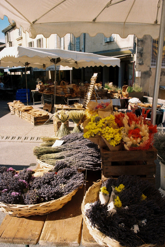 Lavender and other fresh flowers in a provençal weekly market stall in the centre of Gordes