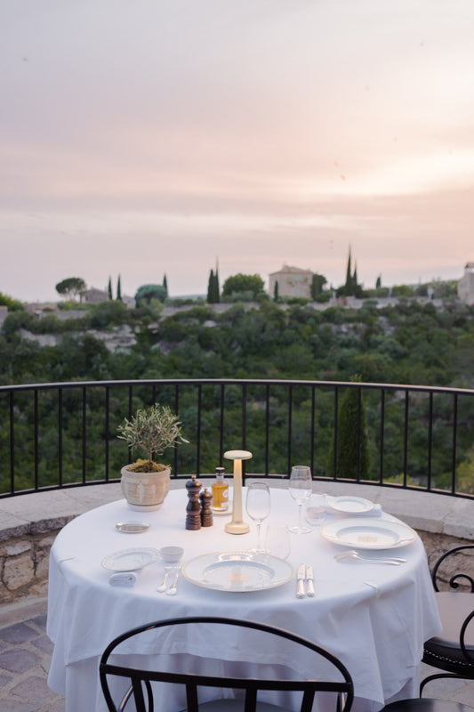 Dinner with views at the restaurant L'Orangerie, in Gordes, at sunset