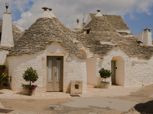 A few trulli, the cone shaped roof houses, in Alberobello, Puglia, Italy