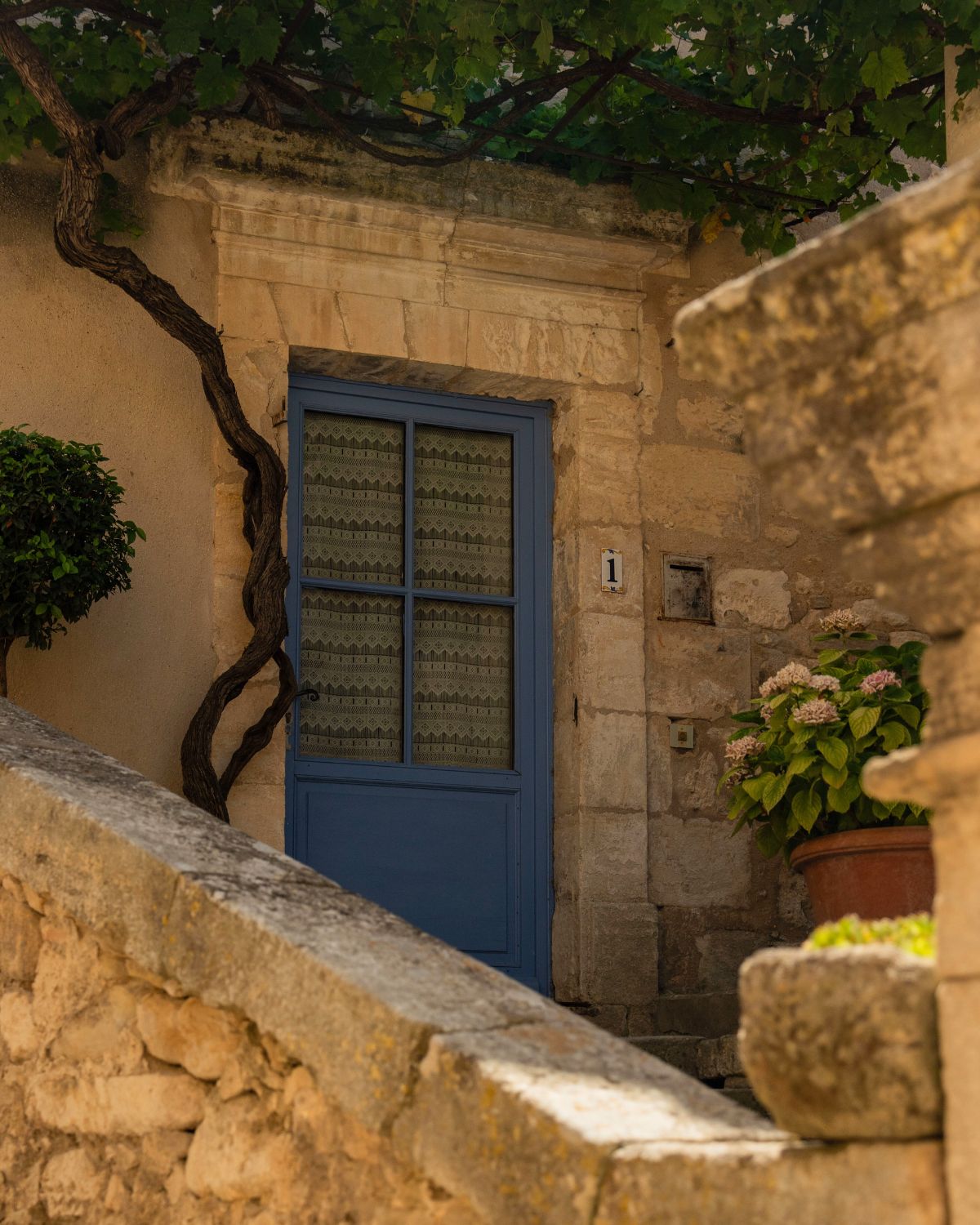 Cobblestone corner in Lacoste with blue door.